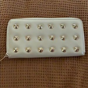Cream wallet with gold spikes